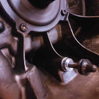 Adjusting device for mechanical clutch release bearings