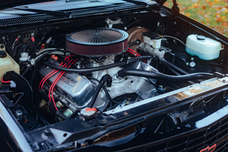 Chevrolet C1500 454 SS engine bay with AN hoses